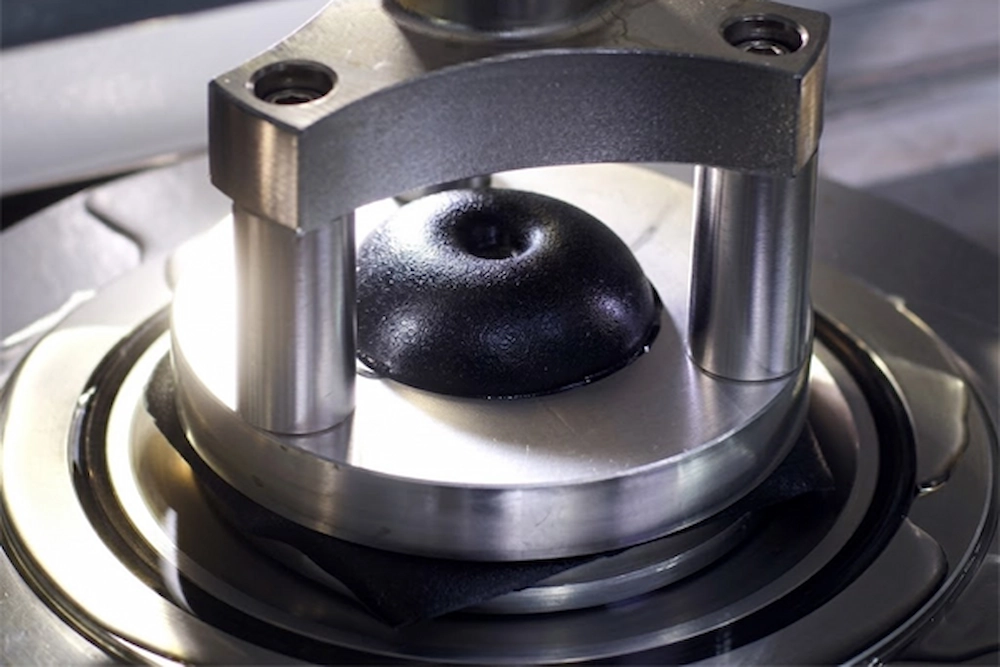 High-pressure water resistance test at SQG lab to verify the liquid barrier integrity of safety glove coatings.