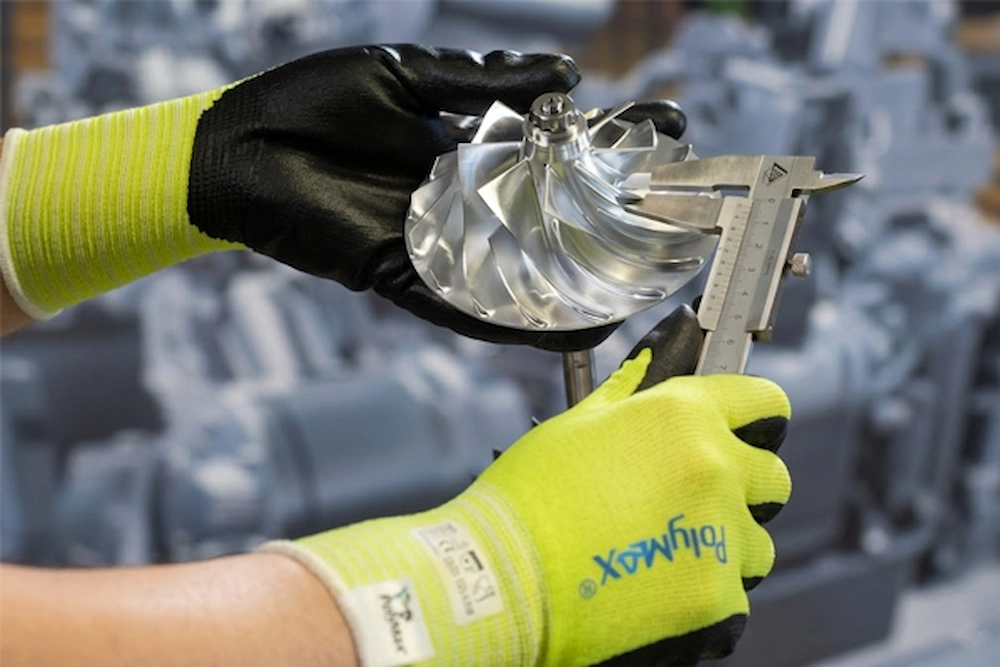 Macro detail of the world's first tungsten fiber safety glove engineered by SQG for severe mechanical hazards.
