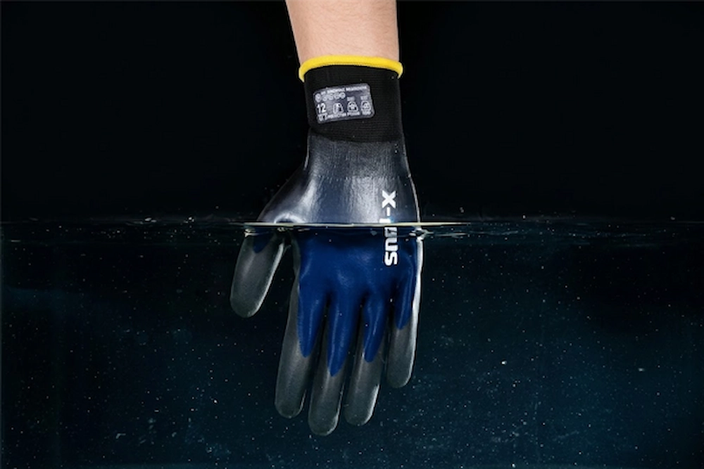 Hazardous liquid rolling off the impermeable surface of an X-Supra chemical and viral resistant safety glove.
